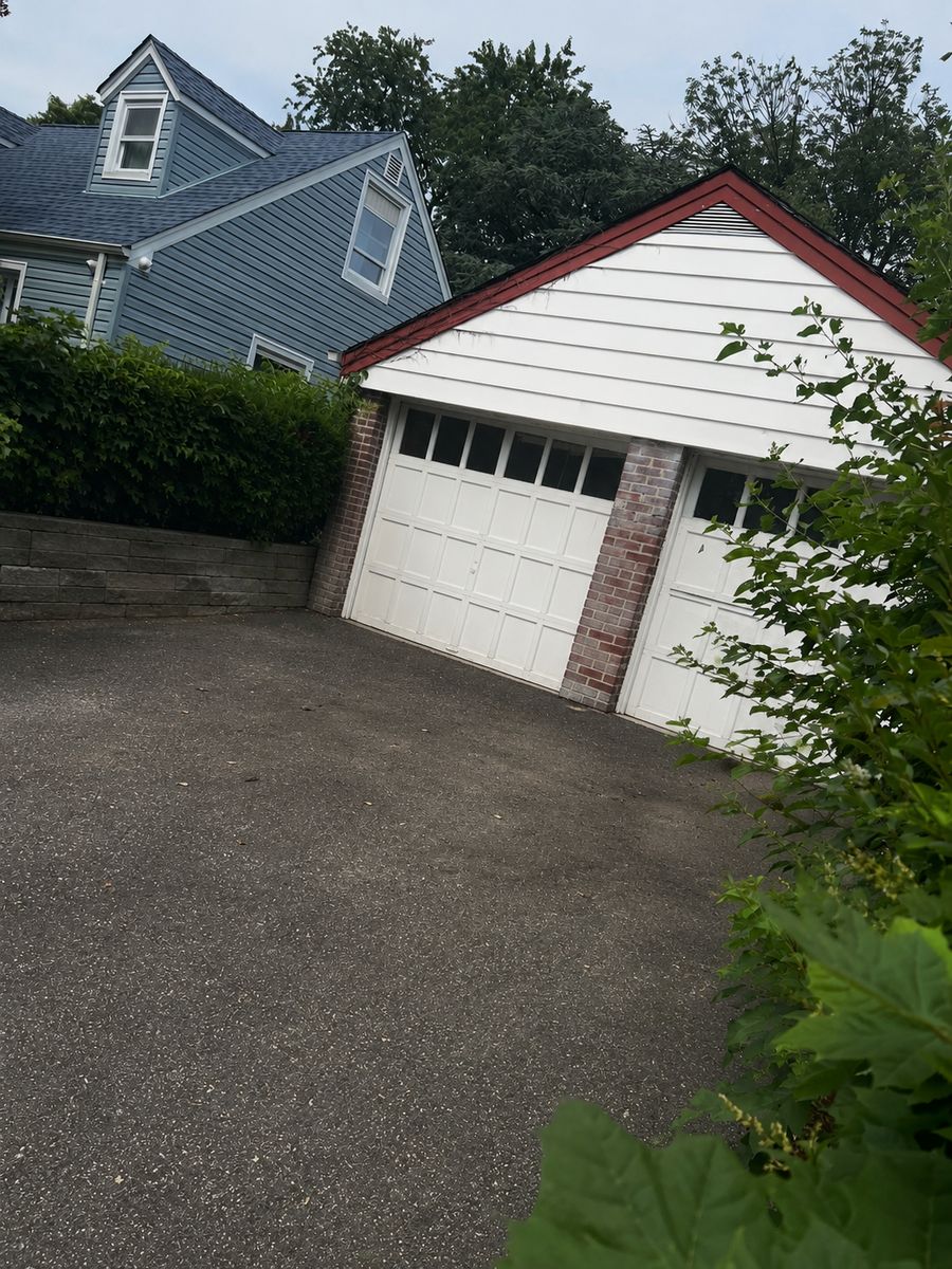 Clean, empty driveway after junk removal by Deadlift Junk Removal in New Hyde Park