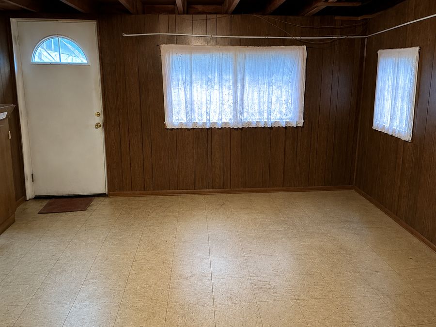 Cleared, broom-swept basement room after junk removal by Deadlift Junk Removal in Queens