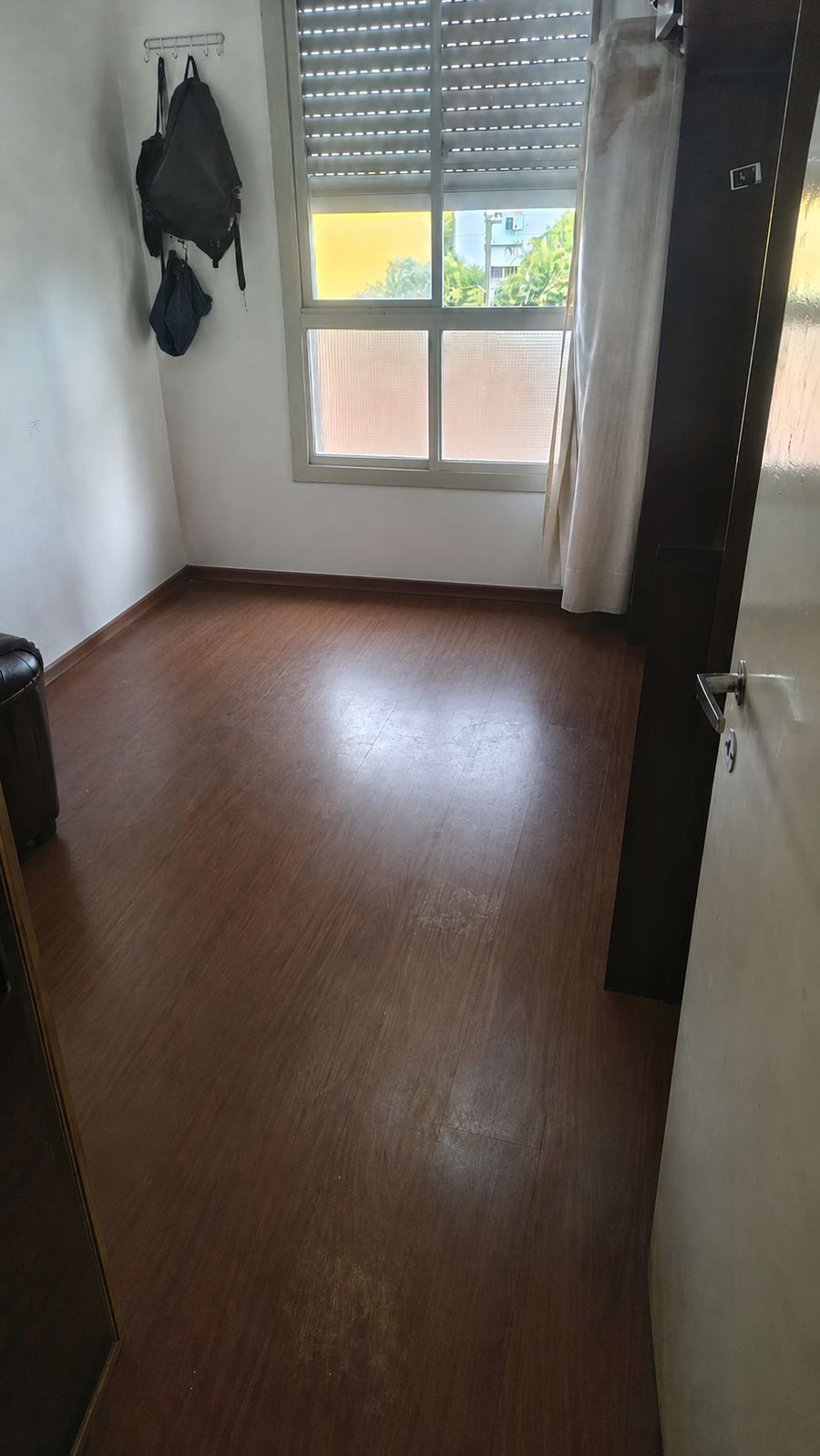 Clean, empty bedroom after a full cleanout by Deadlift Junk Removal in Queens